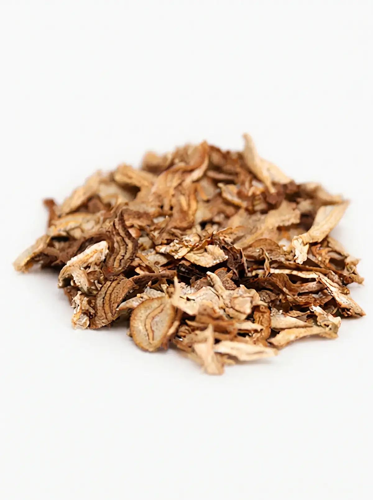 A small heap of cut, rolled and expanded tobacco stem on a white background