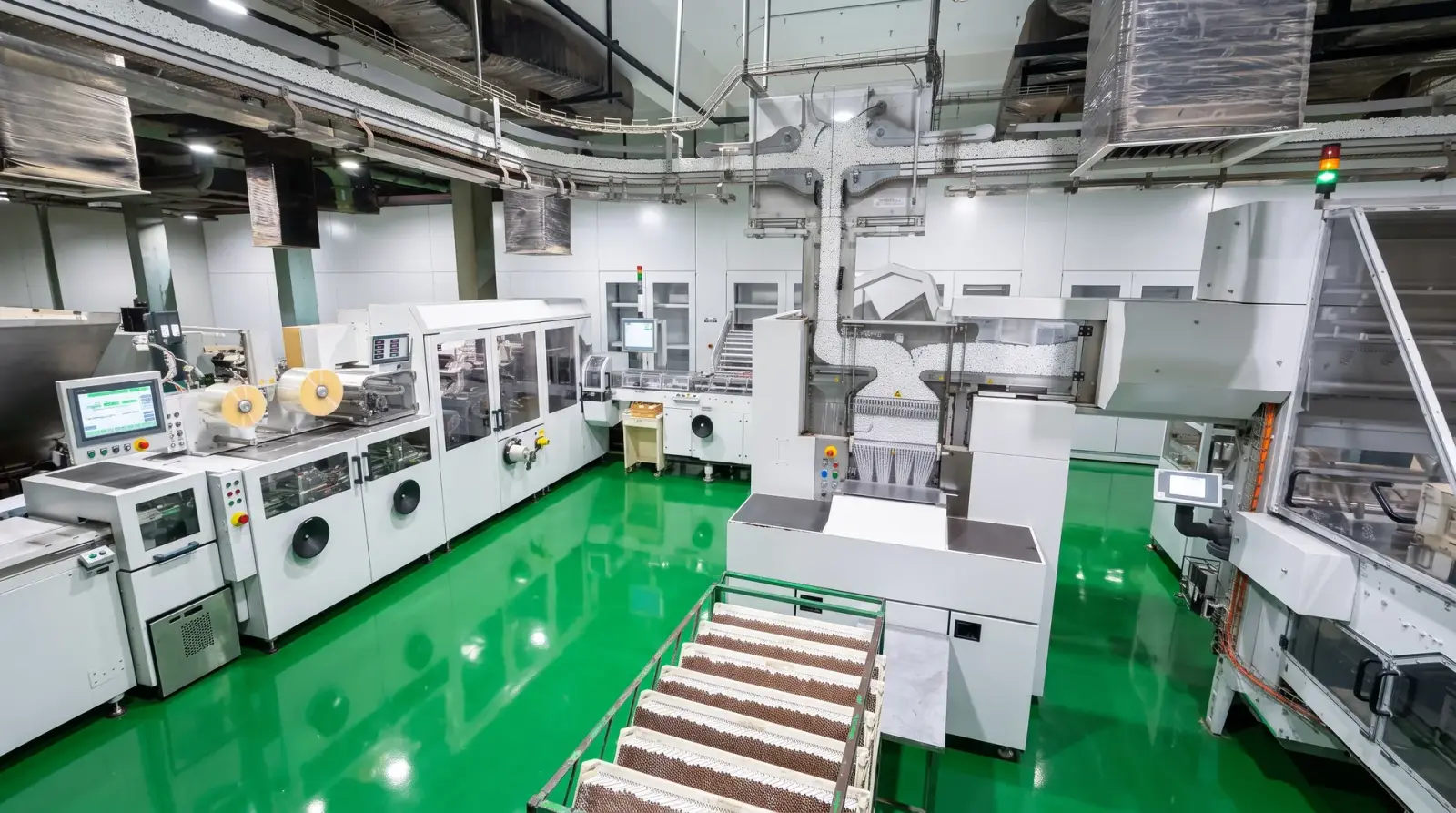 Cigarette packing machinery viewed from above on a factory floor